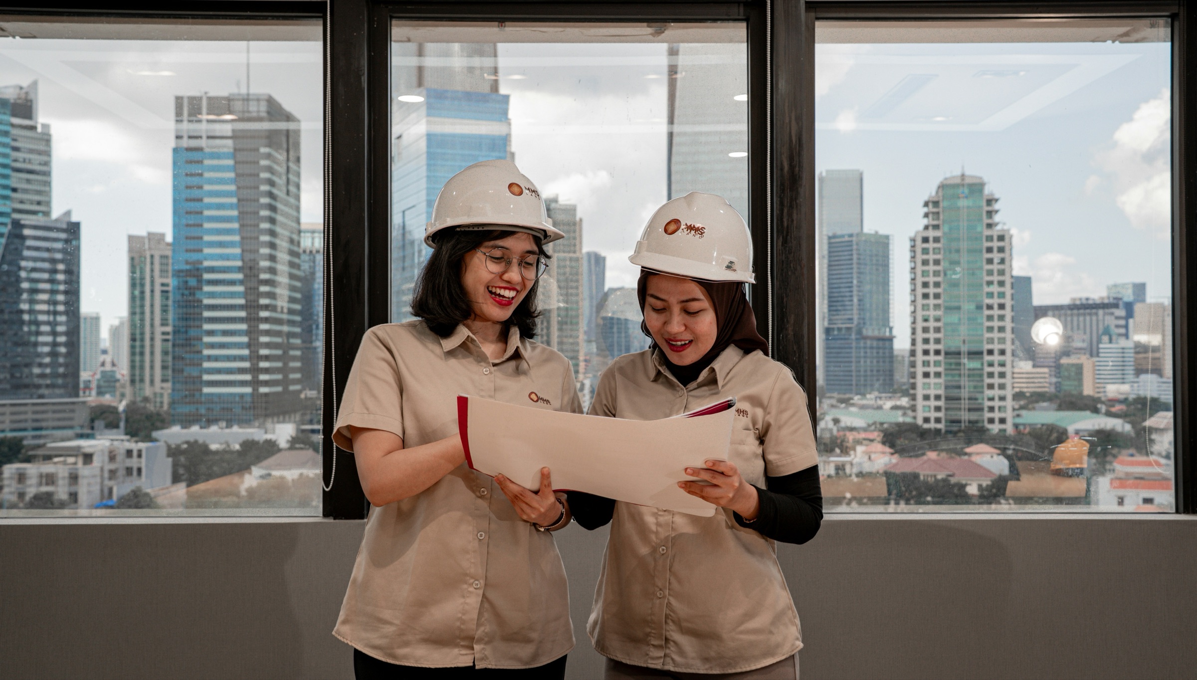 Two construction managers reviewing project plans