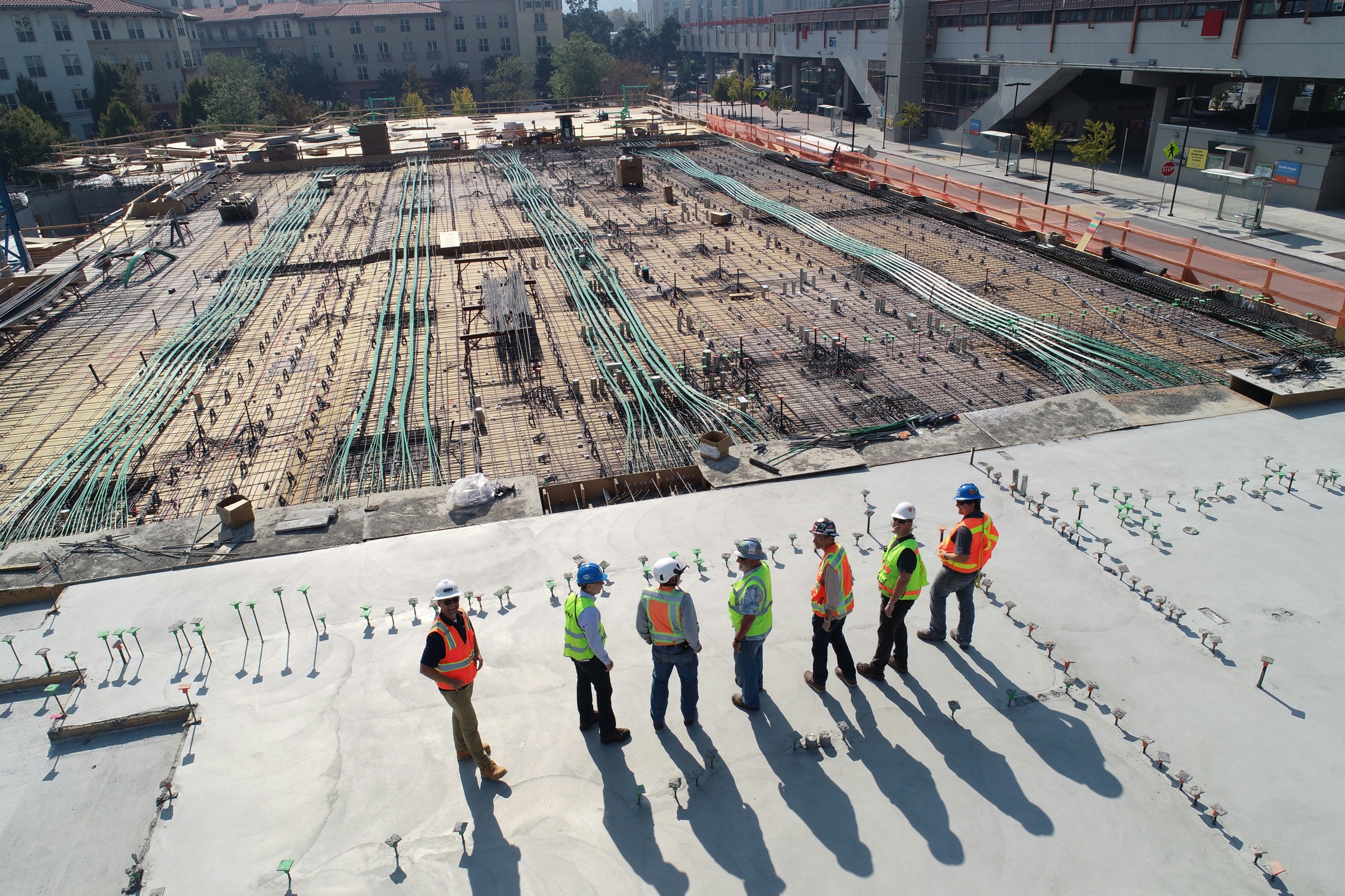 Construction project team on site overlooking a major concrete deck